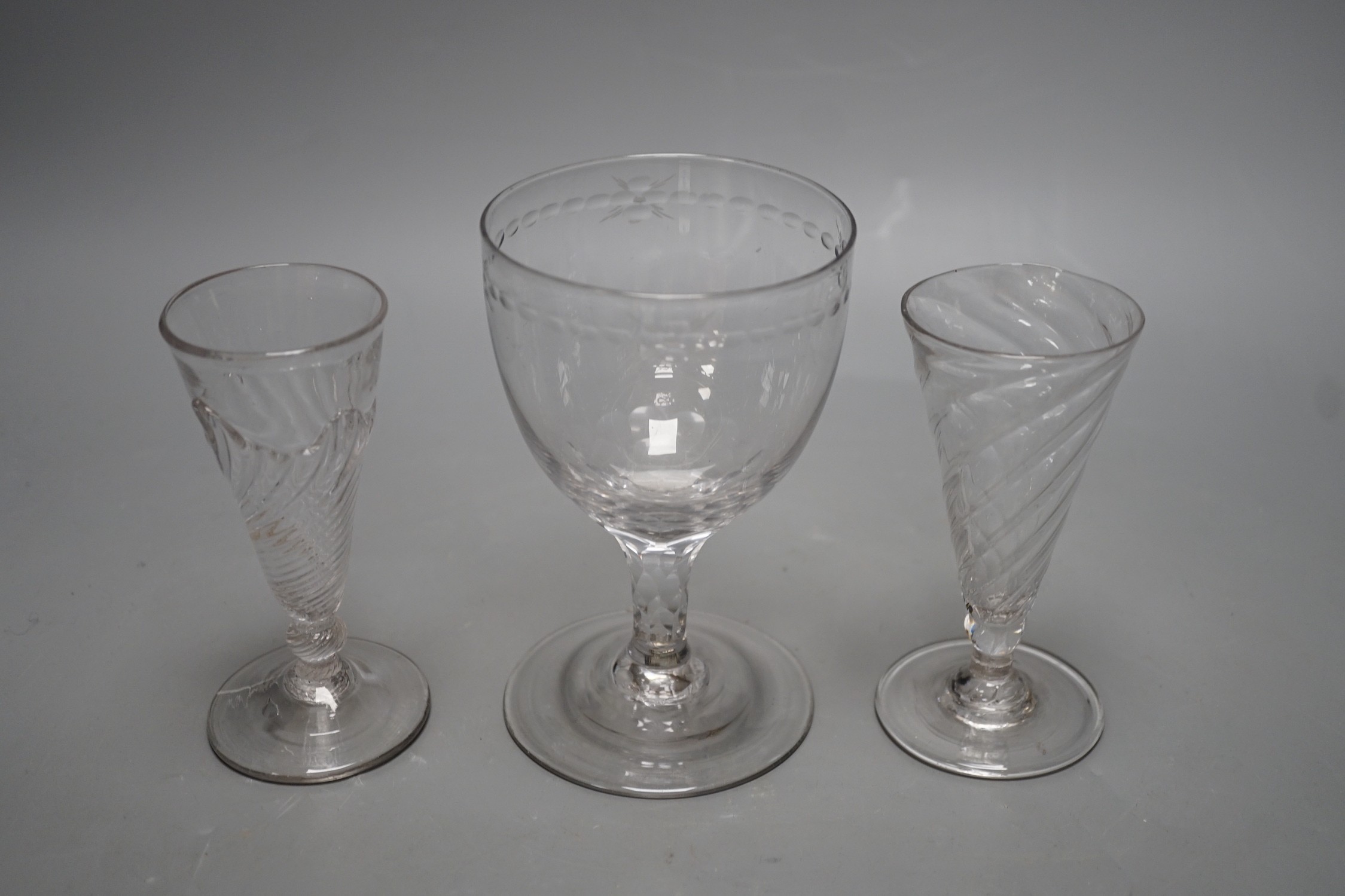 Two wrythen ale flutes, 18th century and a facet stem ‘OXO’ glass rummer, tallest 15cms high
